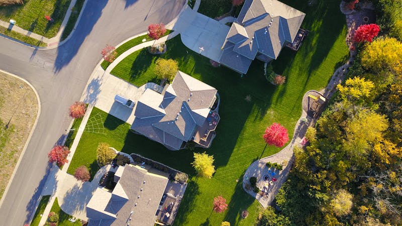 Aerial view of the quiet, tree-lined neighborhood surrounding TrueNest in Harrisburg, NC